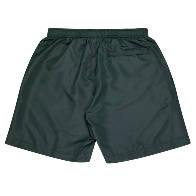 A pair of dark green kids' sports shorts featuring an elastic waist and a back pocket. The shorts also have a logo.