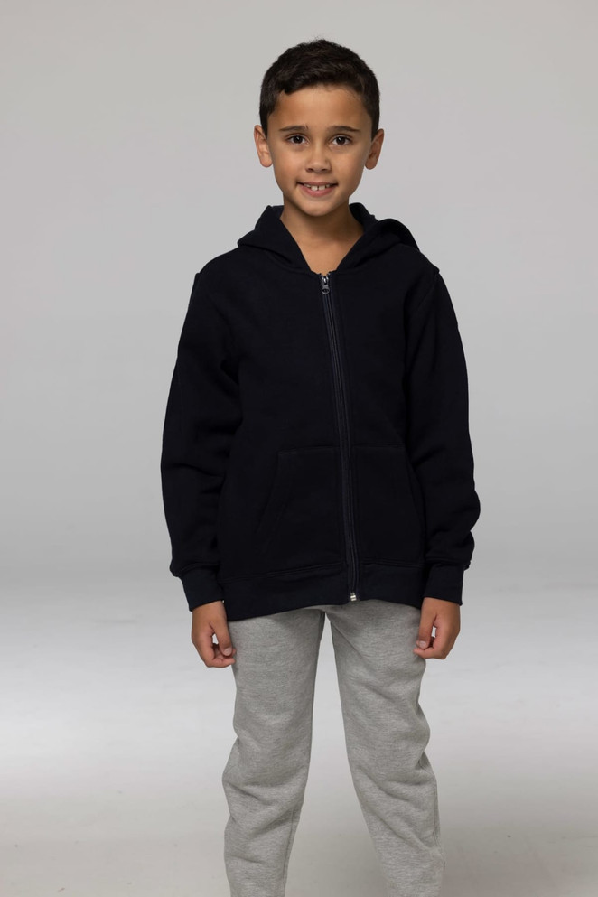A child wearing a black zip-up hoodie with a hood, paired with grey pants, standing against a neutral background.