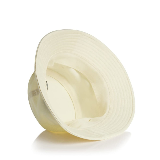 A cream bucket hat featuring a wide brim and an interior lining, with a small logo on the side.