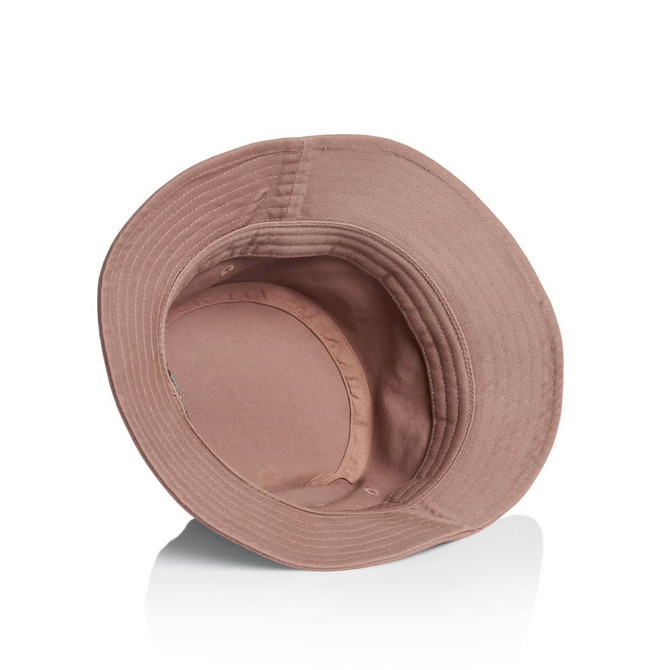 A pink bucket hat with a wide brim and an interior lining. It features a logo on the inside.