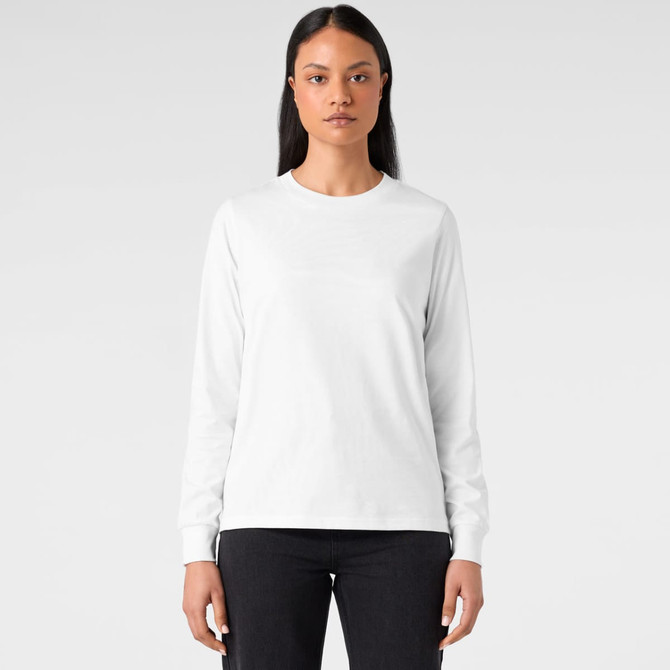 A long-sleeve white T-shirt featuring a logo, styled with a simple design and paired with black jeans.