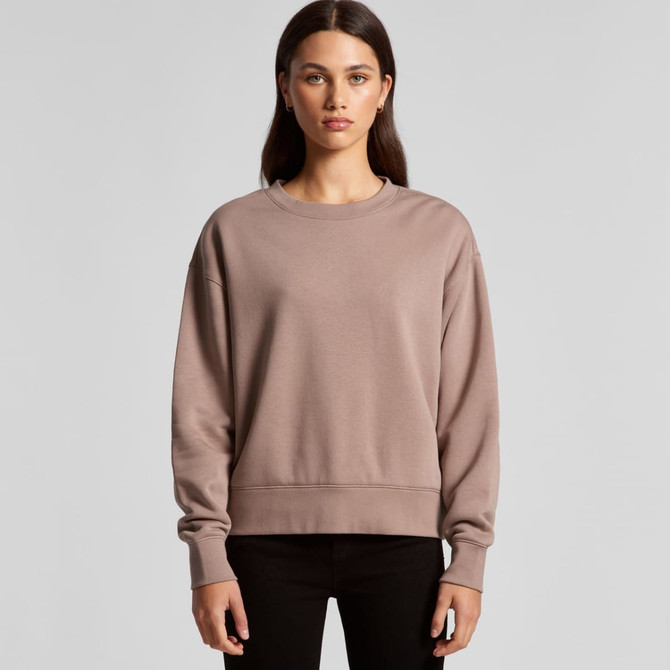A relaxed-fit women's jumper in a soft taupe colour. It has a simple design and features a logo on it.