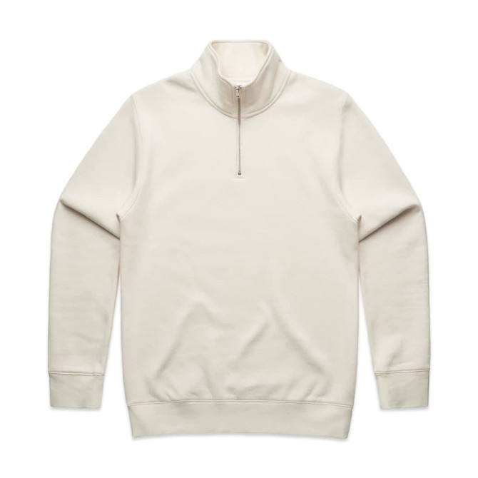 A cream-coloured half zip crew jumper, featuring long sleeves and a zippered collar, with a logo on the front.