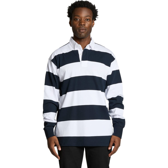 A man wearing a long-sleeve polo shirt with navy and white rugby stripes. The shirt features a collar and branding.