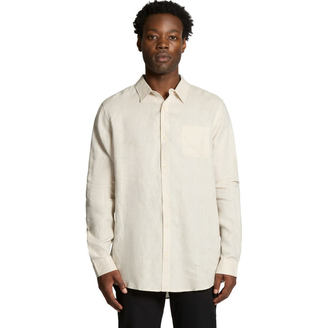 A linen shirt in a light beige colour with a pocket and a collared neckline, featuring long sleeves.