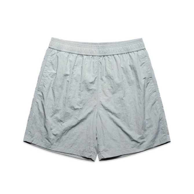 Light grey swim shorts with an elastic waistband, featuring a logo on the side.