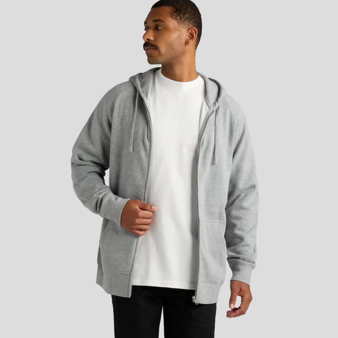 A grey zip hoodie is worn by a man over a plain white t-shirt, featuring a hood and a front zip.
