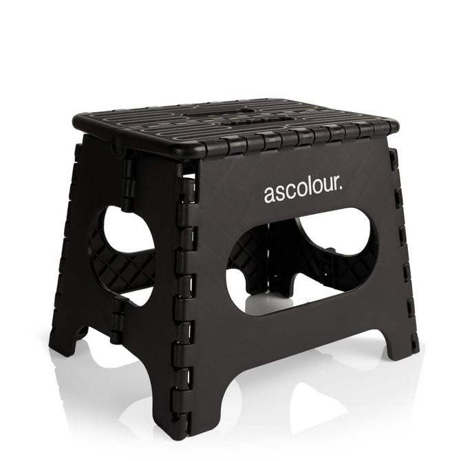 A black utility stool featuring a sturdy design with cut-out handles and a textured surface. It has a logo.