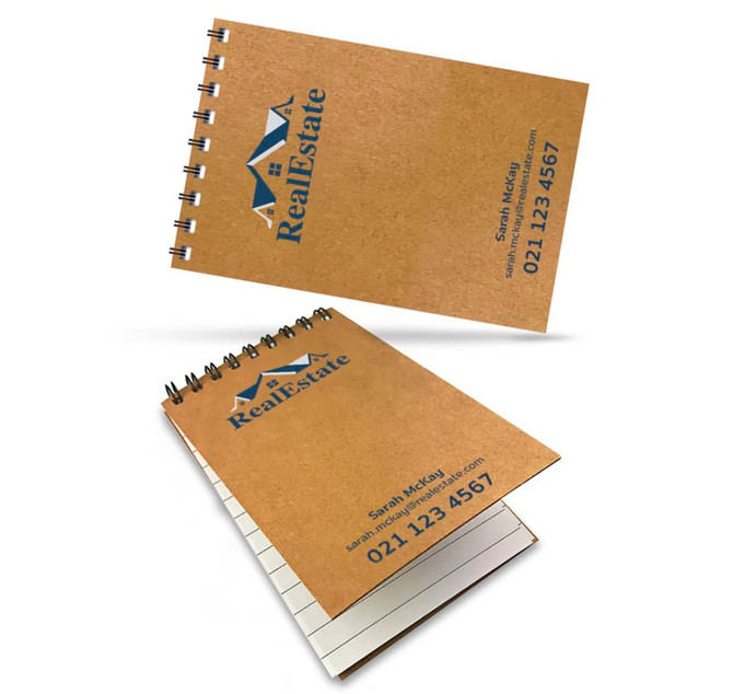 Aspiral-bound A7 notebook with a natural kraft cover and branding, featuring blank pages inside.