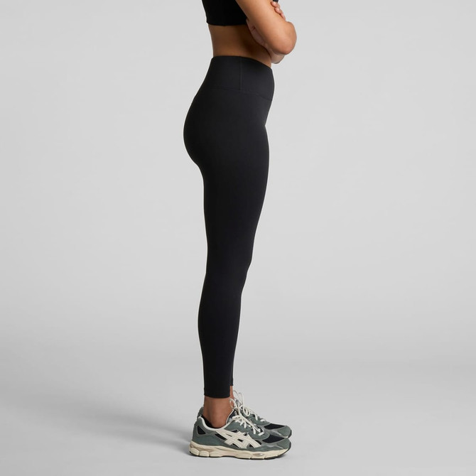 A pair of black seamless leggings displayed on a model, featuring a high waist and fitted design.