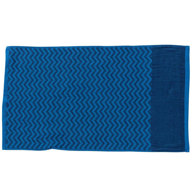 A blue gym towel with a textured pattern on one side and a smooth finish on the other. It features a pocket and a logo.