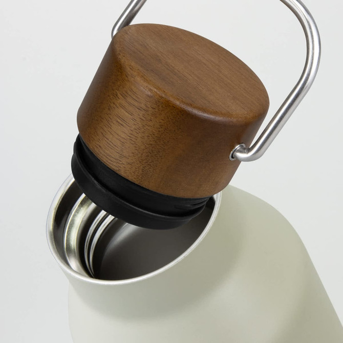 A drink bottle in a soft green shade with a wooden and metal cap, featuring an interior metal liner.