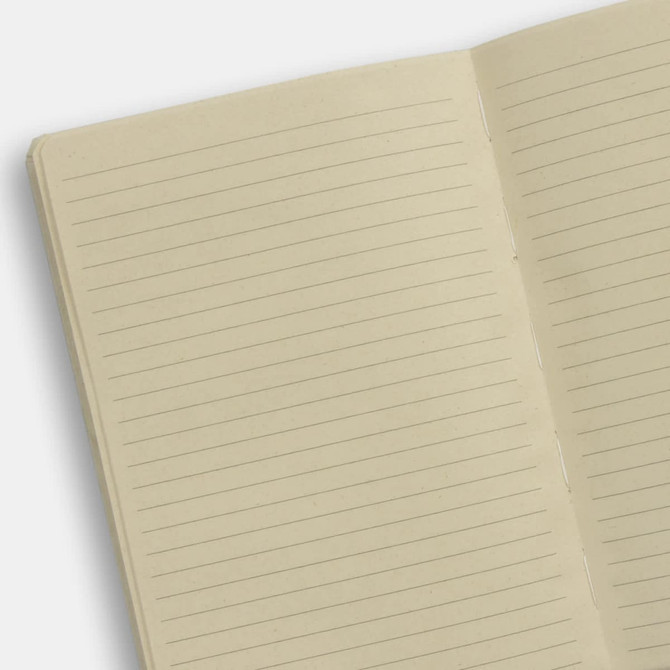 A beige notebook with lined pages, featuring a simple design and a visible binding.