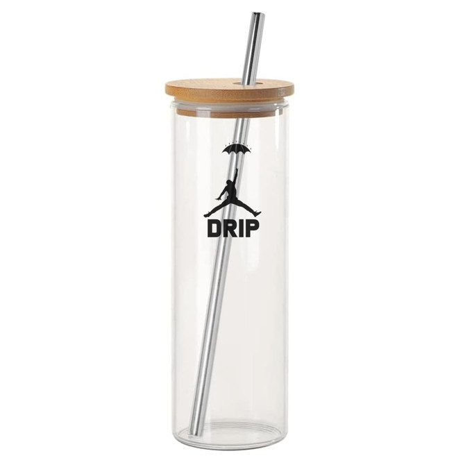 A drink bottle made of clear glass with a wooden lid and a metal straw, featuring a logo.