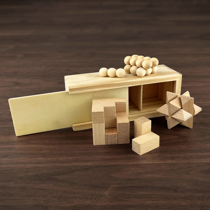A wooden brain teaser puzzle set, featuring various geometric pieces and a storage box in natural wood tones.