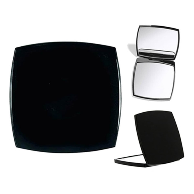 A compact mirror in a sleek black design, featuring a small mirrored interior and a smooth exterior.