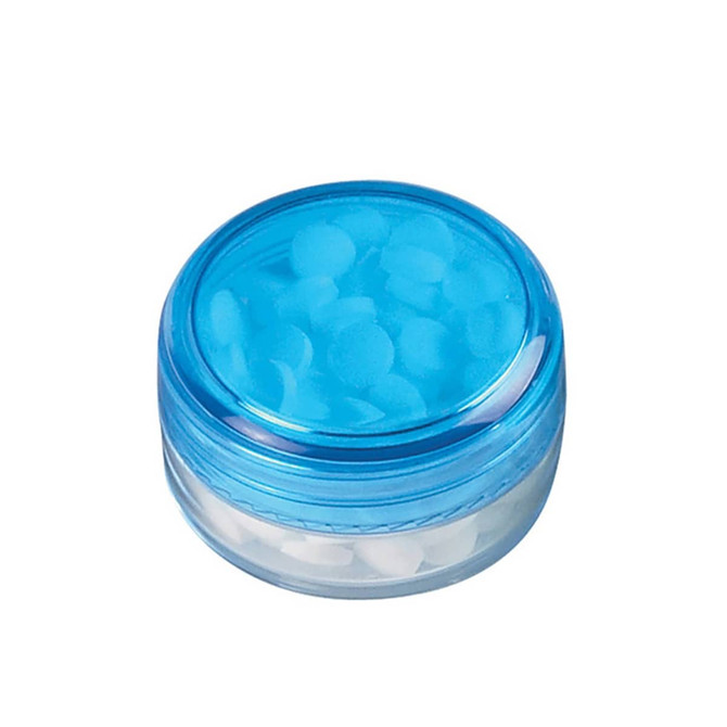 A screw lid mint jar with a transparent base and a blue lid, filled with white mints.