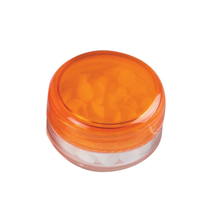An orange screw lid jar containing white mint candies, featuring a transparent base.