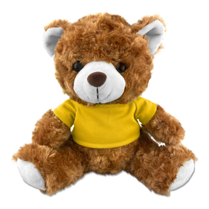 A plush teddy bear with a brown fur appearance, wearing a yellow shirt and featuring a logo on the shirt.