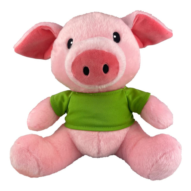 A pink plush pig with a green shirt and black eyes, sitting with legs outstretched. It has a friendly expression.