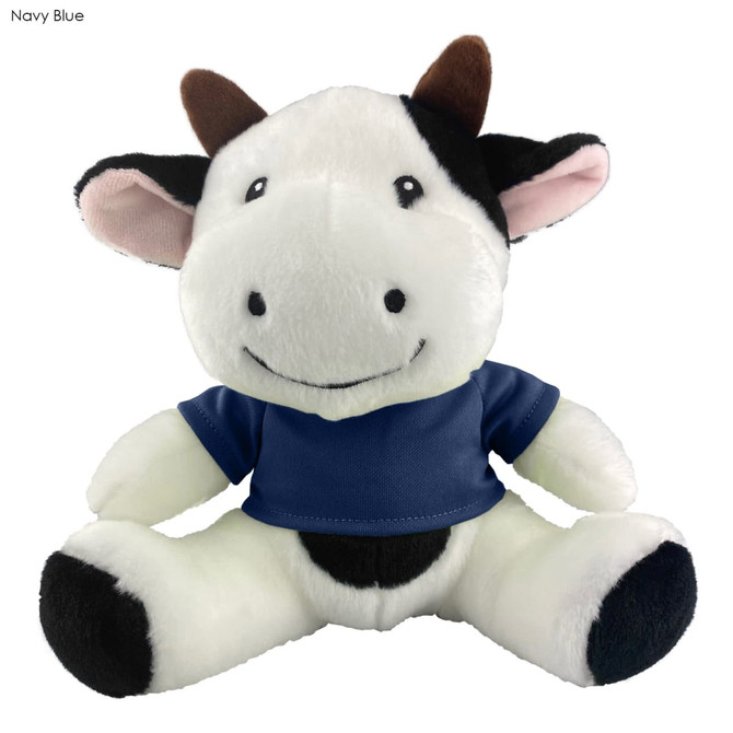 A plush cow toy with a friendly expression, wearing a navy blue shirt and featuring black and white fur.