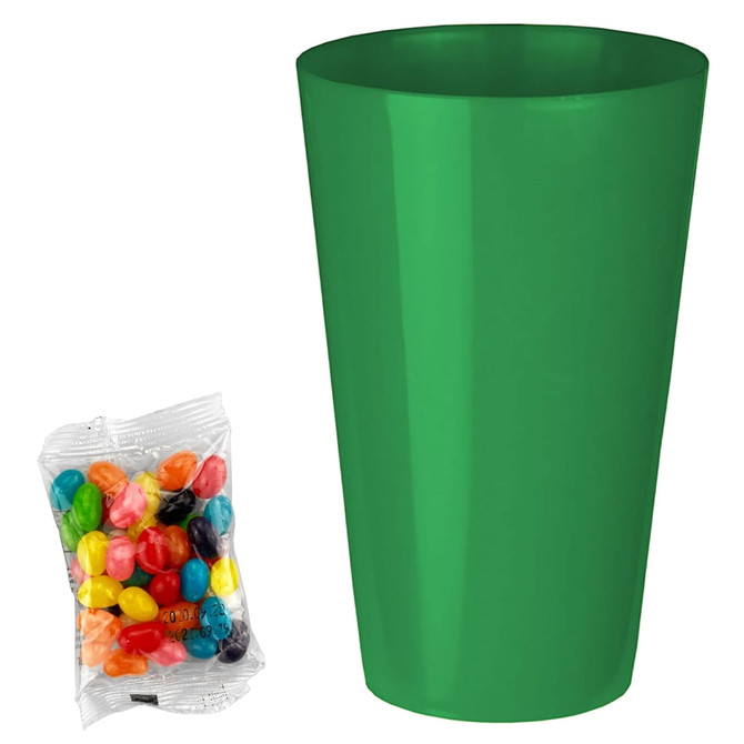 A green party cup next to a pack of colourful jelly beans in various shades. The pack is transparent.