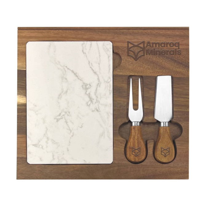 A marble cheeseboard with two wooden-handled knives, set on a dark wood base, featuring a logo.