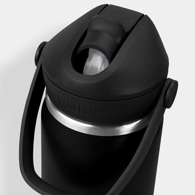 A drink bottle with a black body and silver band, featuring a flip straw and a carrying handle. It has a logo.