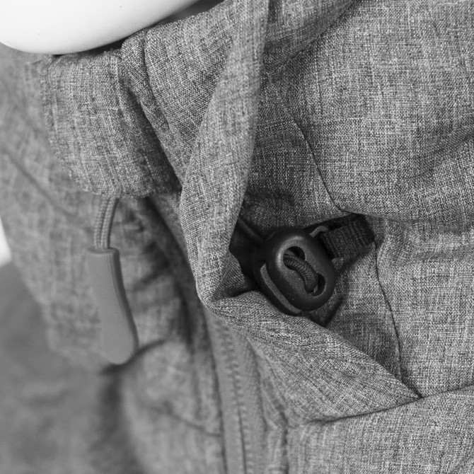 A close-up of a grey puffer jacket featuring a drawstring adjustment and zippered closure. The fabric has a textured finish.