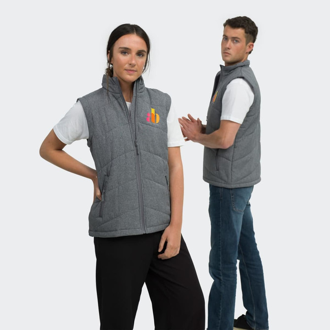 A grey puffer vest with a logo, showcased on a male and female model, styled casually with t-shirts and jeans.