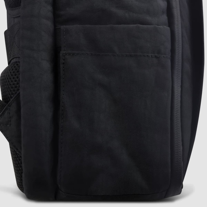 A black travel backpack featuring a side pocket and textured fabric design, with a logo on the front.