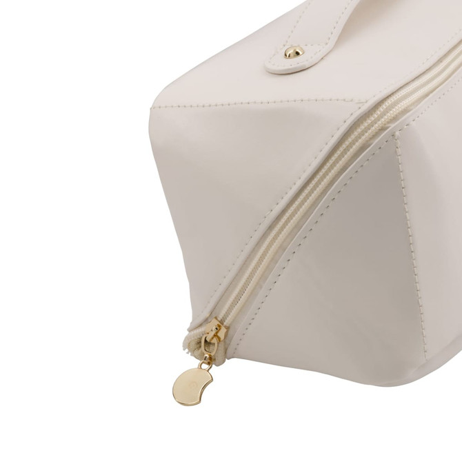 A white toiletry bag with a gold zipper and a small decorative charm. It features a sleek, modern design.
