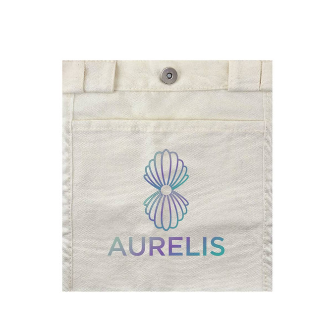 A cream canvas bag featuring a floral logo and the word "AURELIS" in teal and purple.