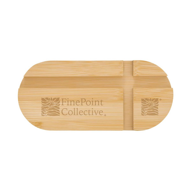 A bamboo phone stand with an oval shape, featuring engraved designs and a logo.