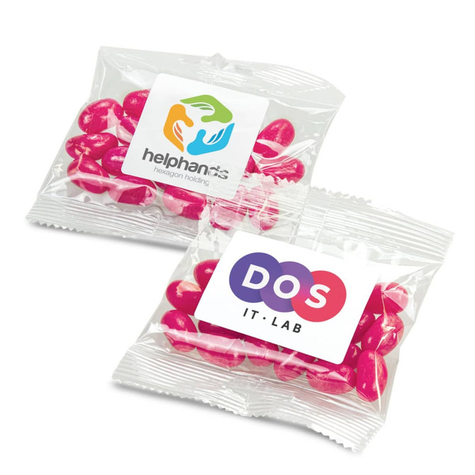 A clear bag containing pink jelly beans, featuring two different logos on the packaging.