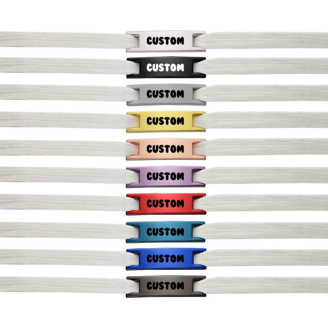 A row of white shoelaces with various coloured charms, featuring a logo and the word "CUSTOM" on each charm.