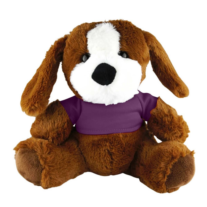 A brown plush dog with floppy ears, featuring a white patch on its face and dressed in a purple shirt.