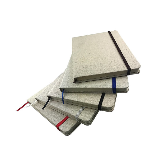 A set of five Farati A5 Cotton Notebooks in neutral tones, each with vibrant elastic band closures.