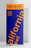 A blue and orange pull-up banner featuring bold text and a patterned design, with a logo at the top.