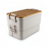 A two-layer lunch box in white, featuring a bamboo lid and sturdy clasps, with a logo on the side.