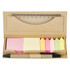 A memo holder containing sticky notes in pink, yellow, and green, a pen, and a ruler, all in a kraft paper case.