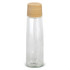 A drink bottle in clear glass with a light wooden lid, featuring a minimalist design and a logo on the bottom.