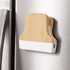 A bamboo fridge magnet clip features a natural bamboo top and a white base, mounted on a metallic refrigerator surface.