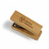 A bamboo stapler in a wooden box, featuring a logo on the side. The product is natural brown in colour.
