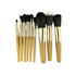 A set of nine makeup brushes in various sizes, featuring gold ferrules and light brown handles, neatly arranged.