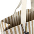 A striped tote bag in beige and cream with sturdy fabric handles and a small pocket. It features a logo tag.