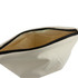 A large cosmetic bag in cream with a black zipper, featuring a spacious interior. It has a minimalist design.