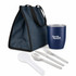 A navy blue lunch bag with a cup, silver cutlery, and a translucent spatula. The cup has a logo.