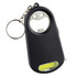 A drink bottle opener key ring in black, featuring a smiling face design and a built-in light at the bottom.