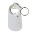 A drink bottle opener key ring in white, featuring a bottle opener and a keyring attachment. It has a simple design with a smiley face.